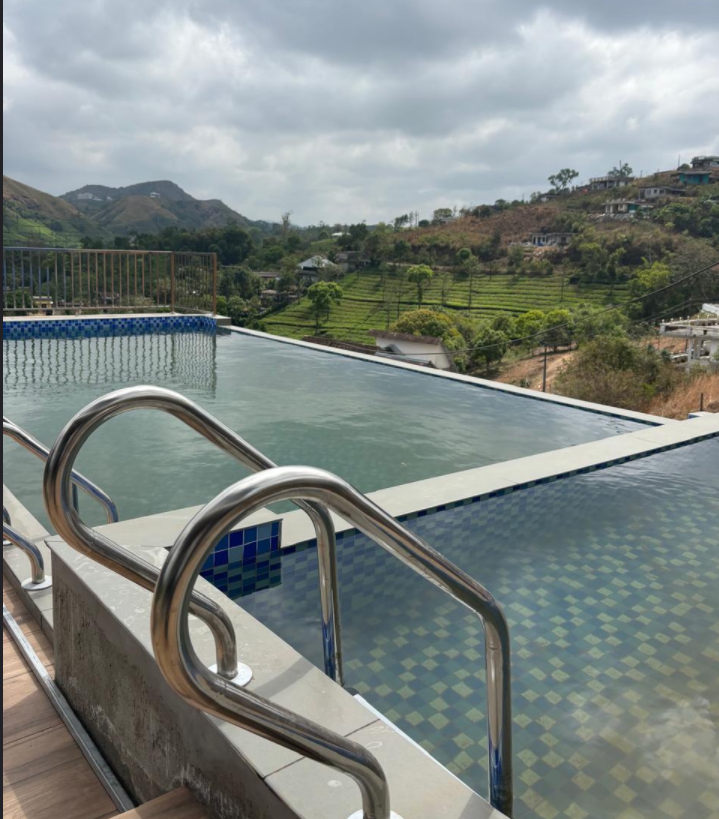 Swimming pool with hill view at Simons Holidays